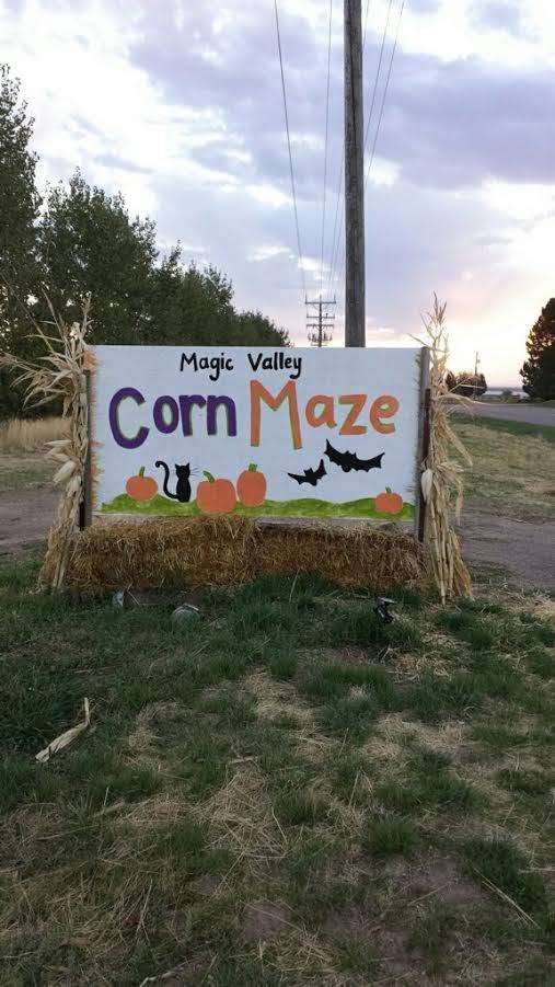 Hand-painted Magic Valley Corn Maze roadside sign