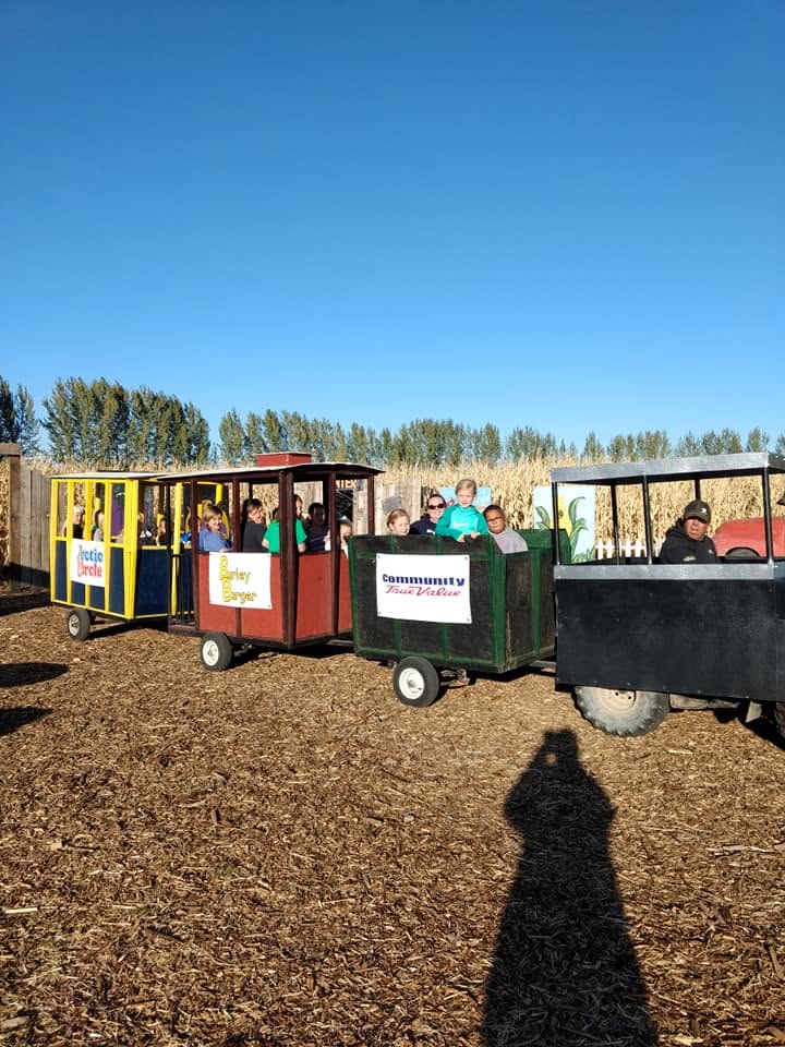 Families riding the colorful Magic Valley Express train